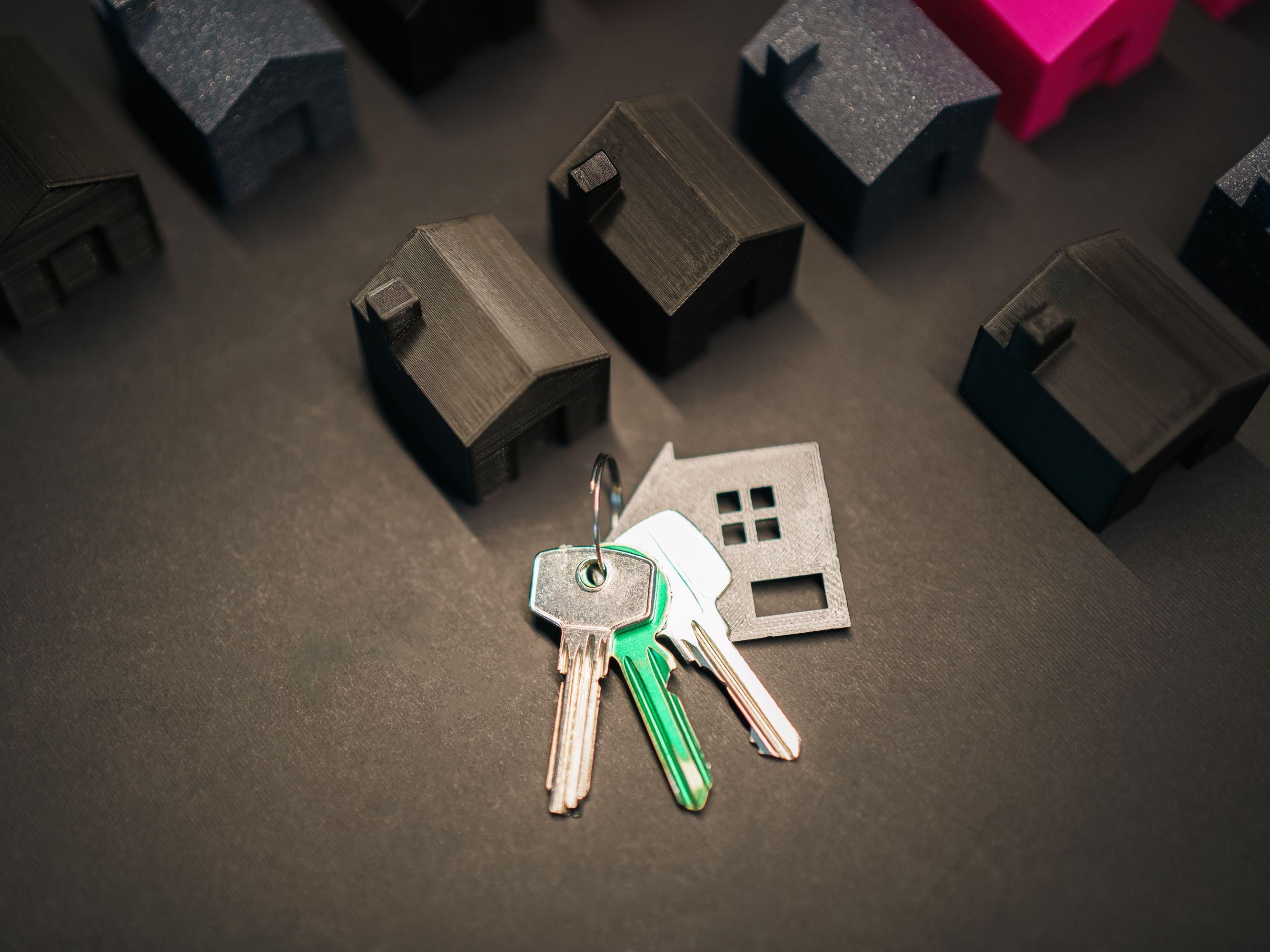 Real estate keys and model homes representing foreclosure and judicial sales in Red Deer Alberta